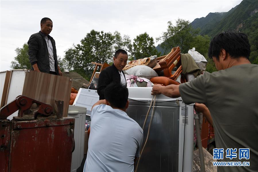 （新華全媒+）（9）千里“挪窩”，踏實開啟新生活