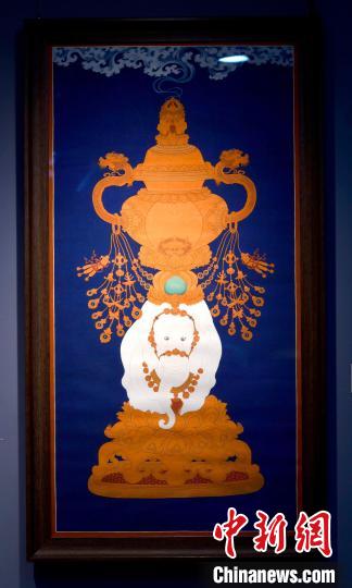 圖為5月16日，展覽中的新創(chuàng)唐卡作品《瑞象承香》?！±盍?攝